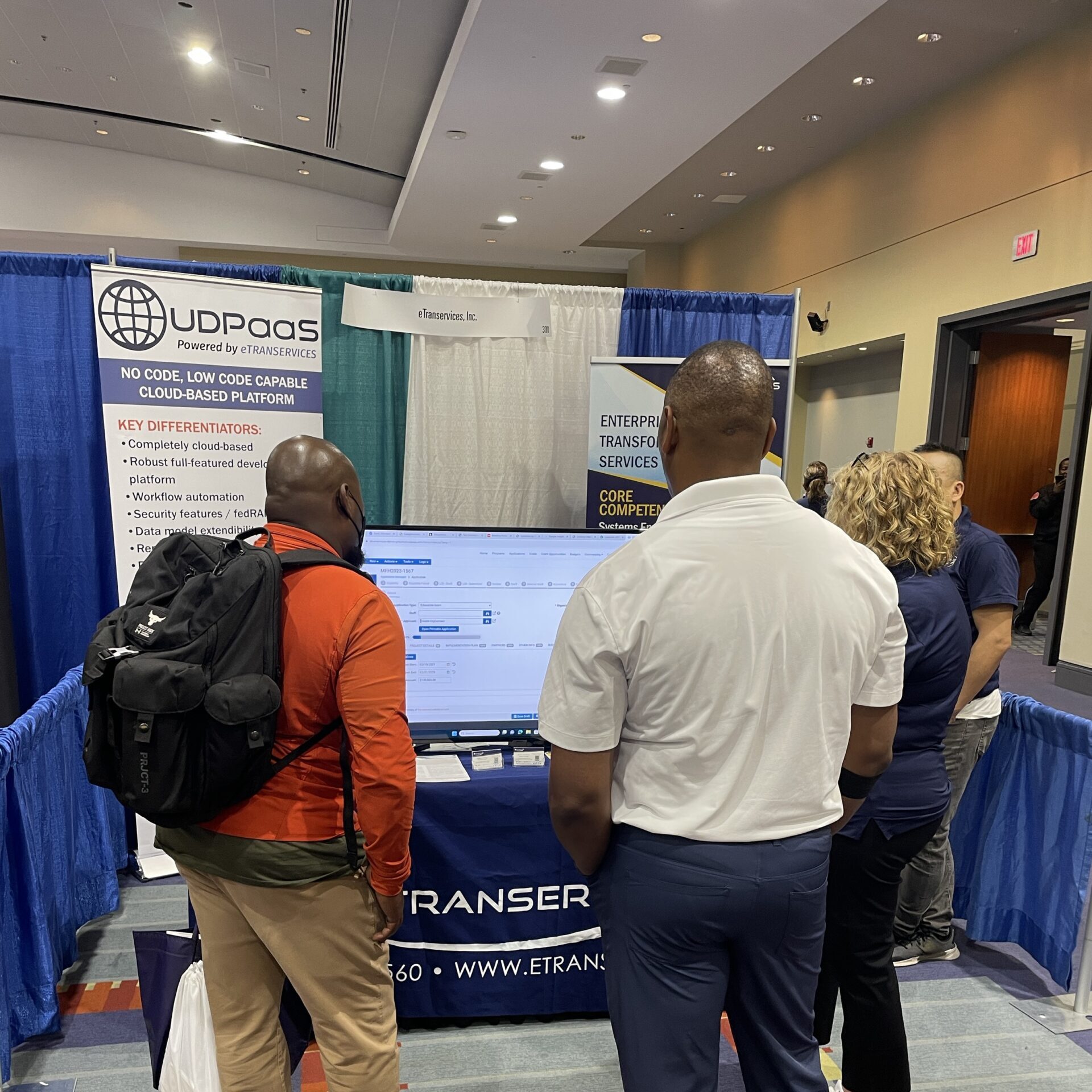 Men visiting a booth during an expo event