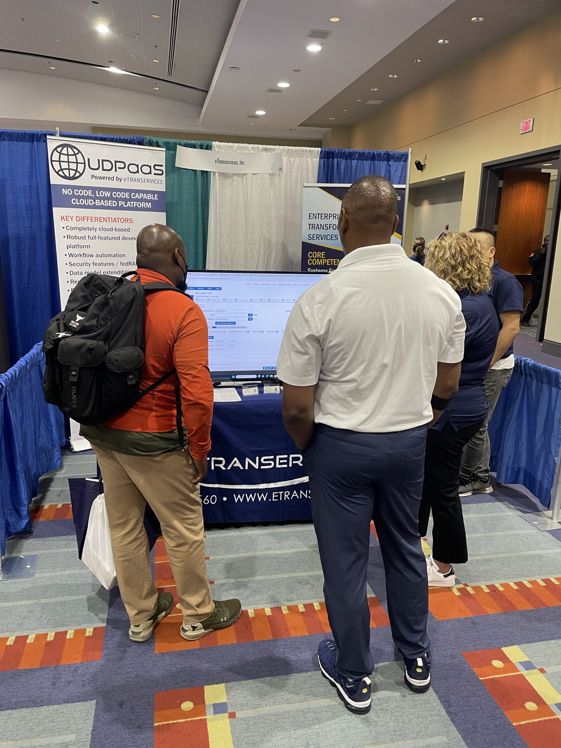 Men visiting a booth during an expo event