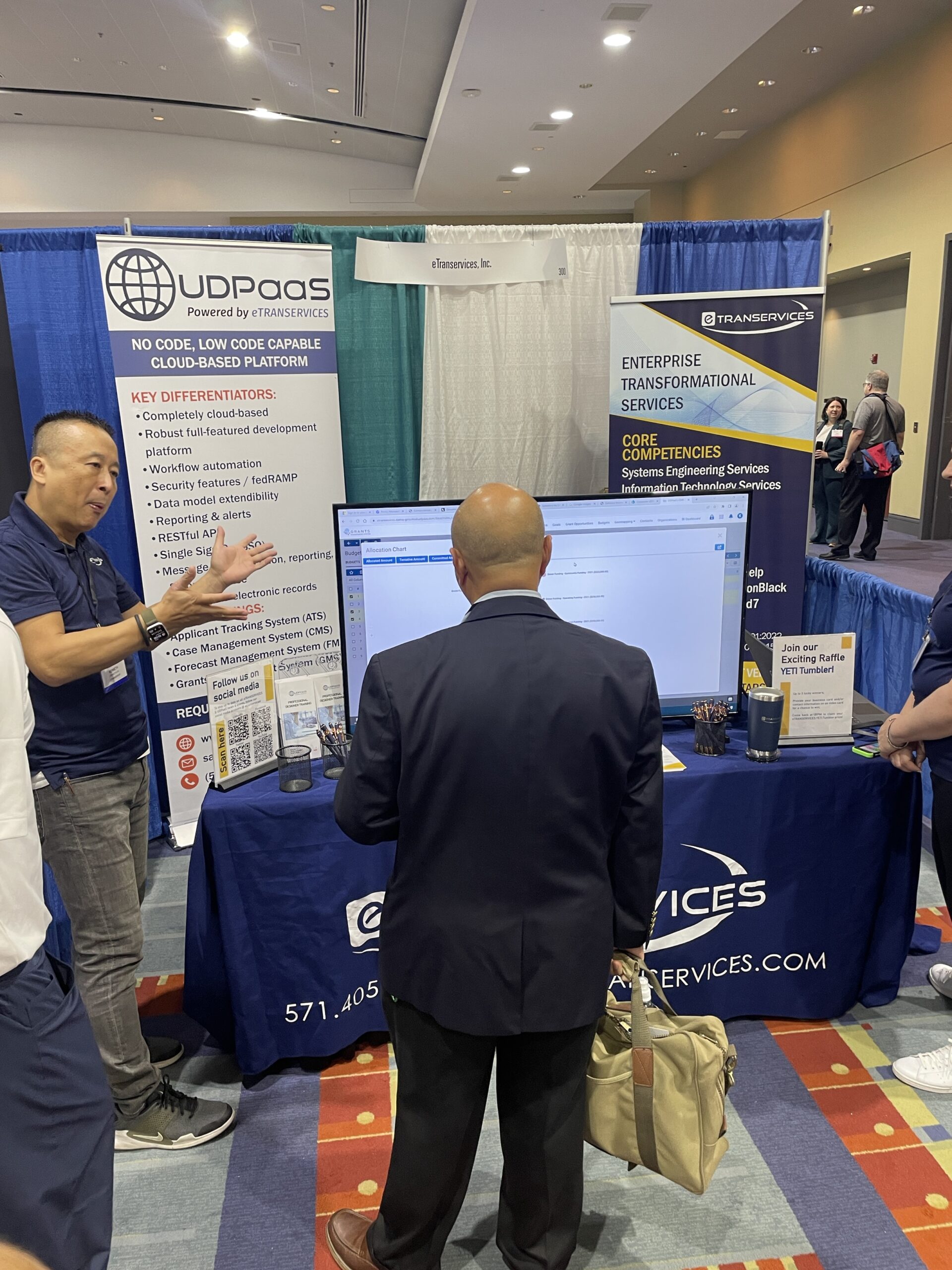 Man getting a demonstration at a booth during an expo event