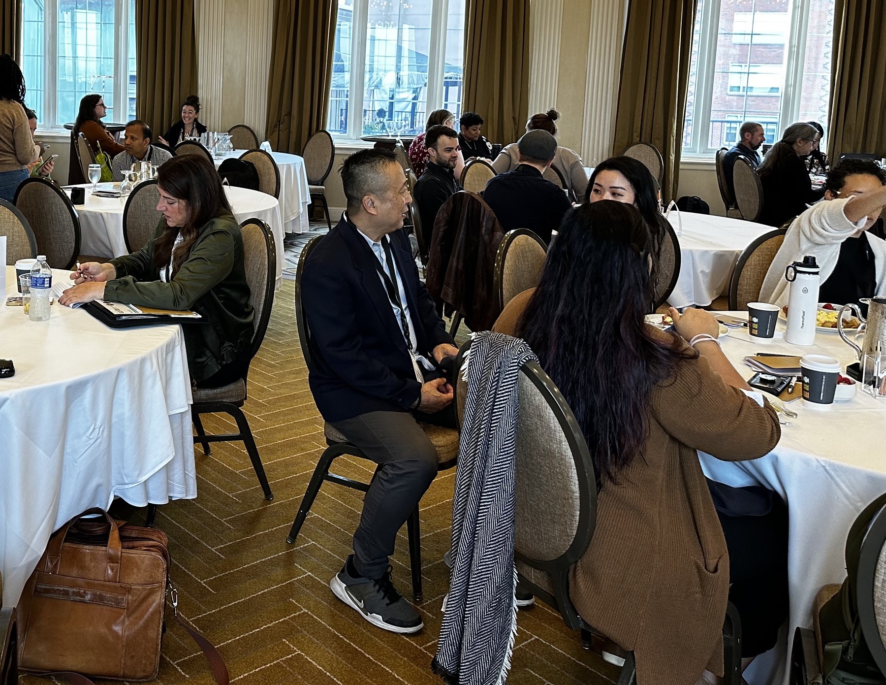 A man sitting at a table during an event