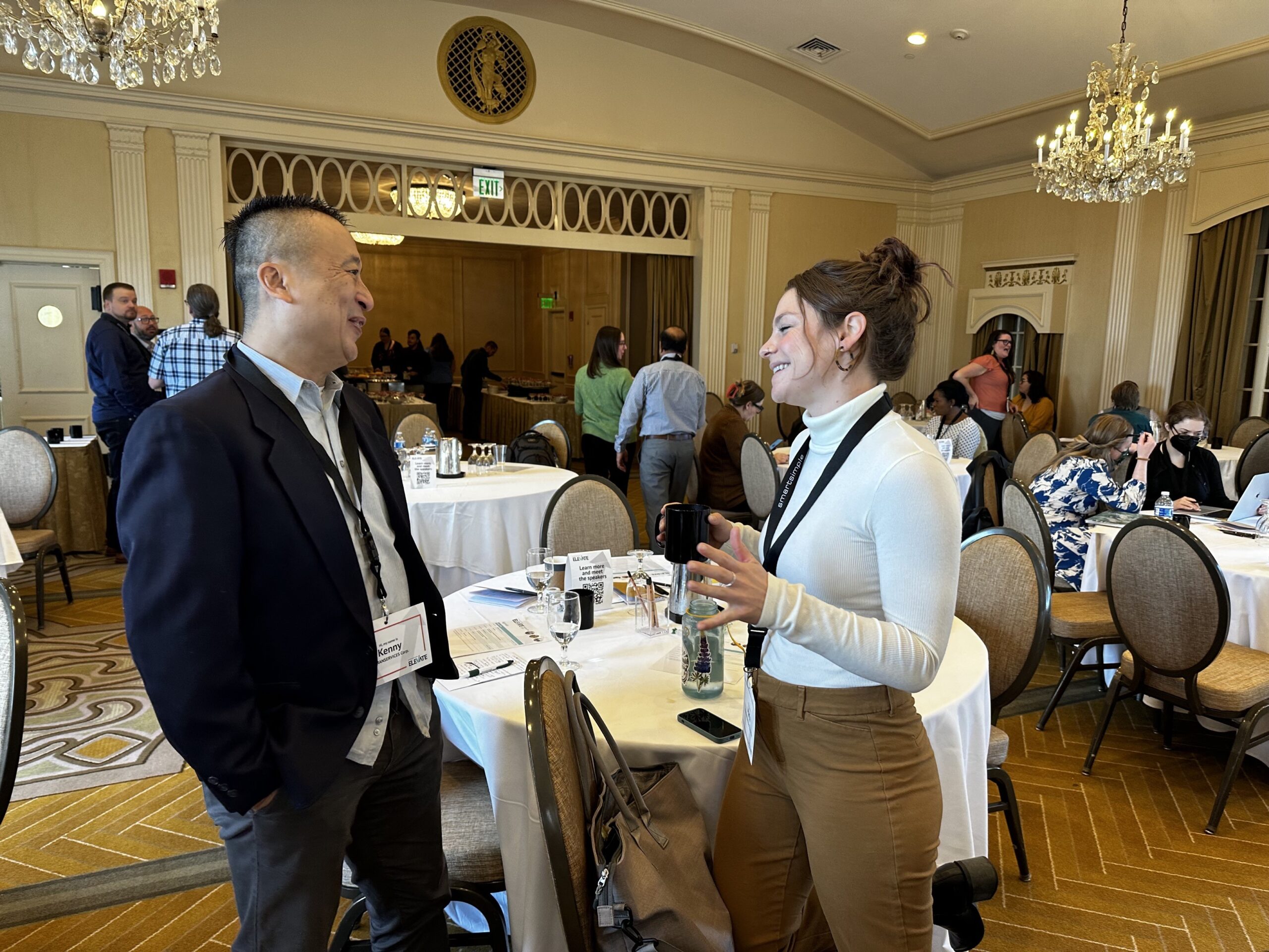 man and woman speaking during an event